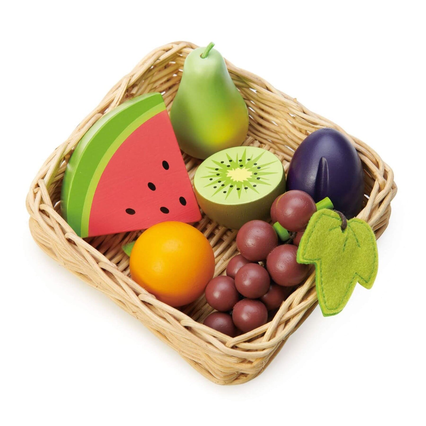 Wicker basket with toy fruits and vegetables on a white background
