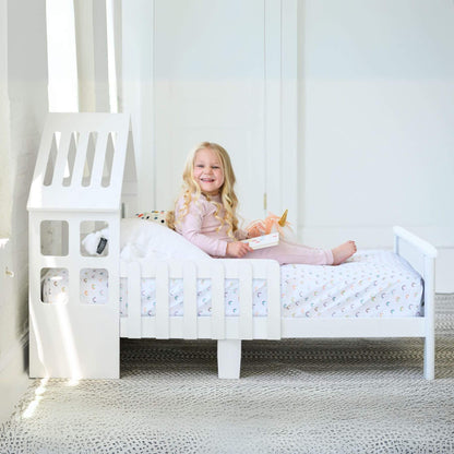 Girl Reading on Little Partners Lil' House Toddler Bed White