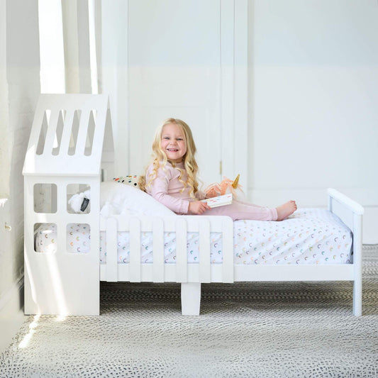 Girl Reading on Little Partners Lil' House Toddler Bed White