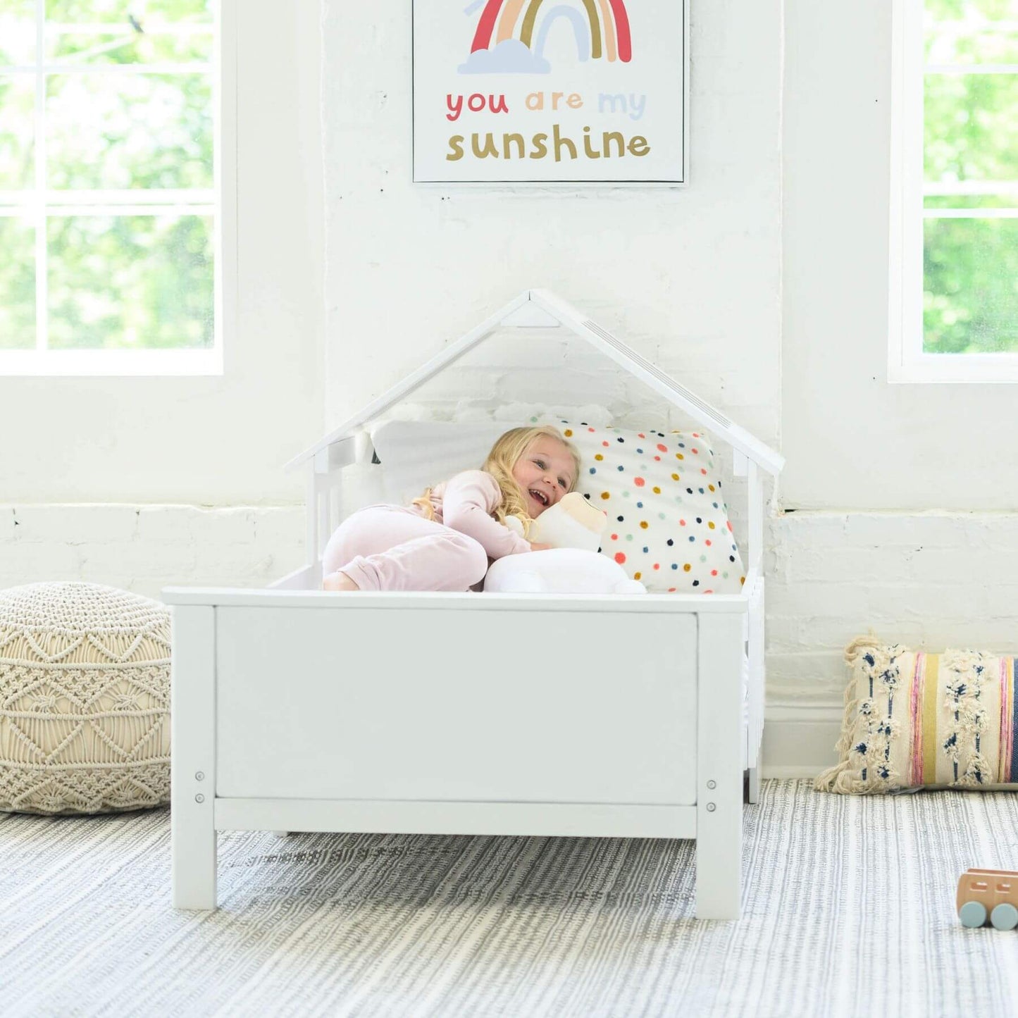 Girl Sleeping on Little Partners Lil' House Toddler Bed White