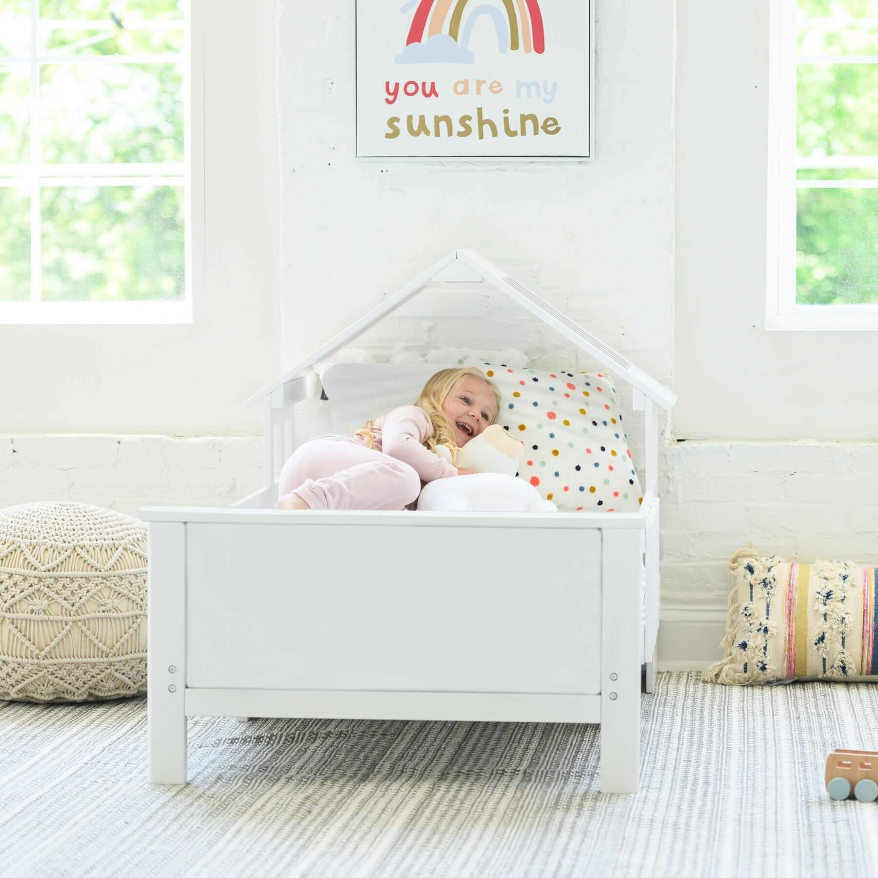 Girl Sleeping on Little Partners Lil' House Toddler Bed White