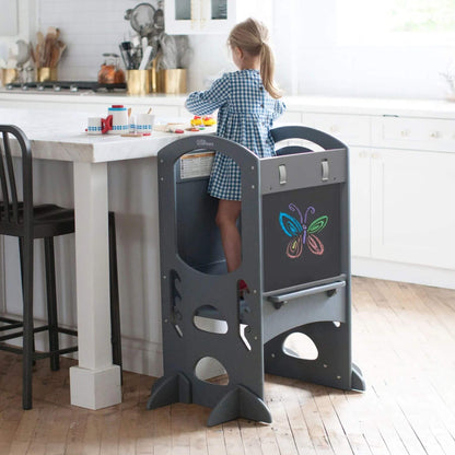 Girl Standing on Little Partners Limited Edition Learning Tower Grey, Playing