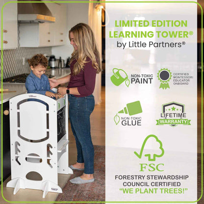 Boy Standing on Little Partners Limited Edition Learning Tower White, with mom Standing next