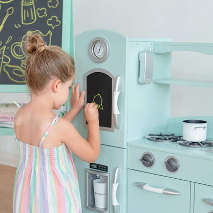 Girl Writing on Board of Teamson Kids Little Chef Westchester Retro Kids Kitchen Playset Mint