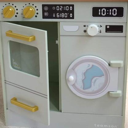 Toy kitchen set with oven and washing machine, featuring digital displays and knobs.