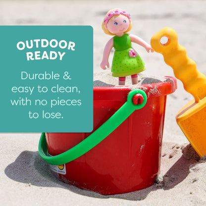 Red bucket with green handle and yellow shovel on sand, featuring a text box about durability and ease of cleaning.