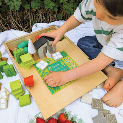 Child playing with Tender Leaf Little Garden Designer outdoors