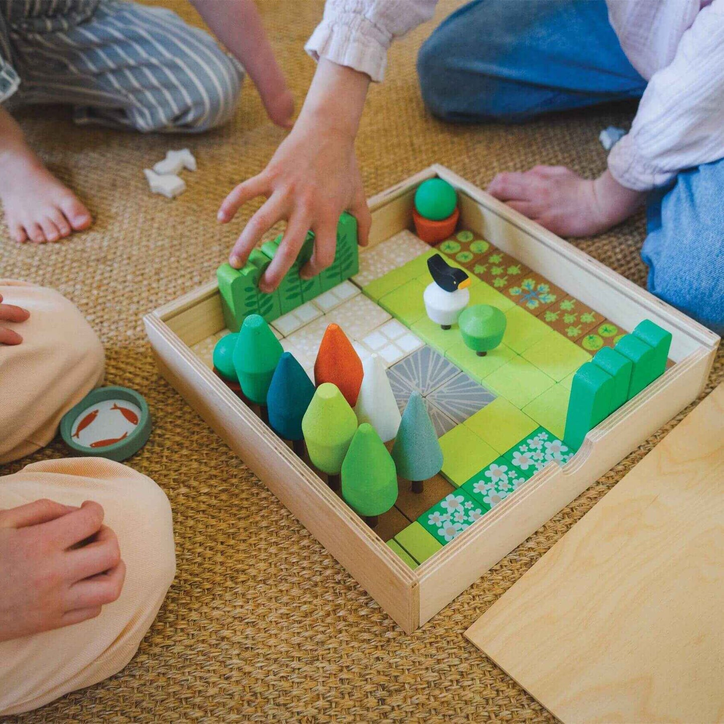 Children playing with Tender Leaf Little Garden Designer on a carpeted floor