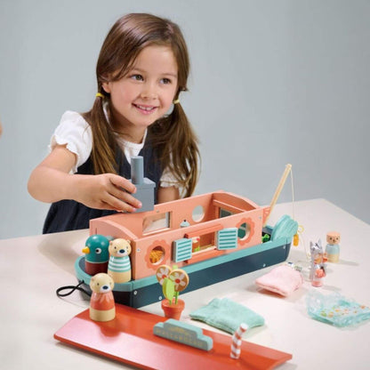 Child playing Tender Leaf Little Otter Canal Boat on a table