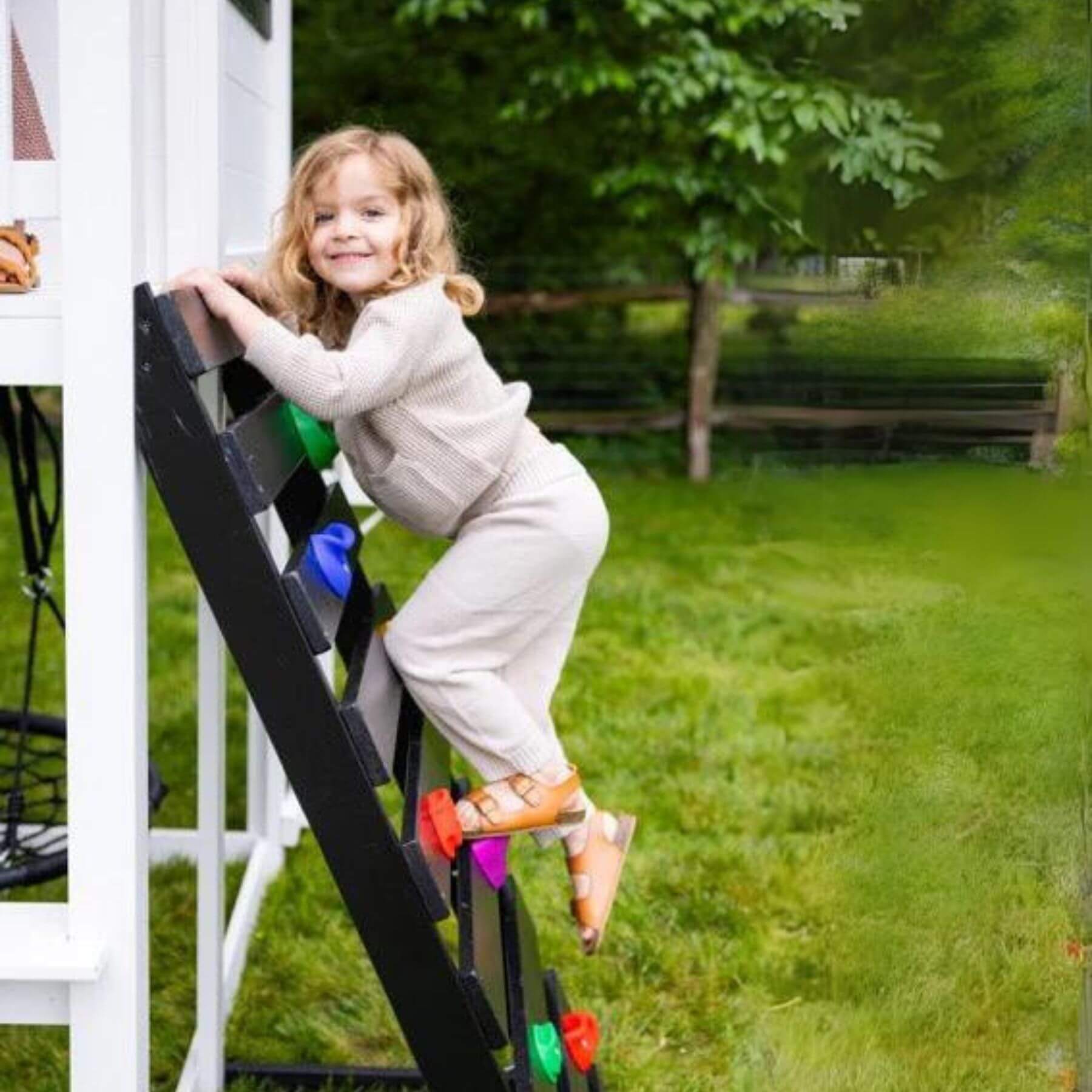 Kid Climbing on Ladder of 2MamaBees Londyn Swing Set