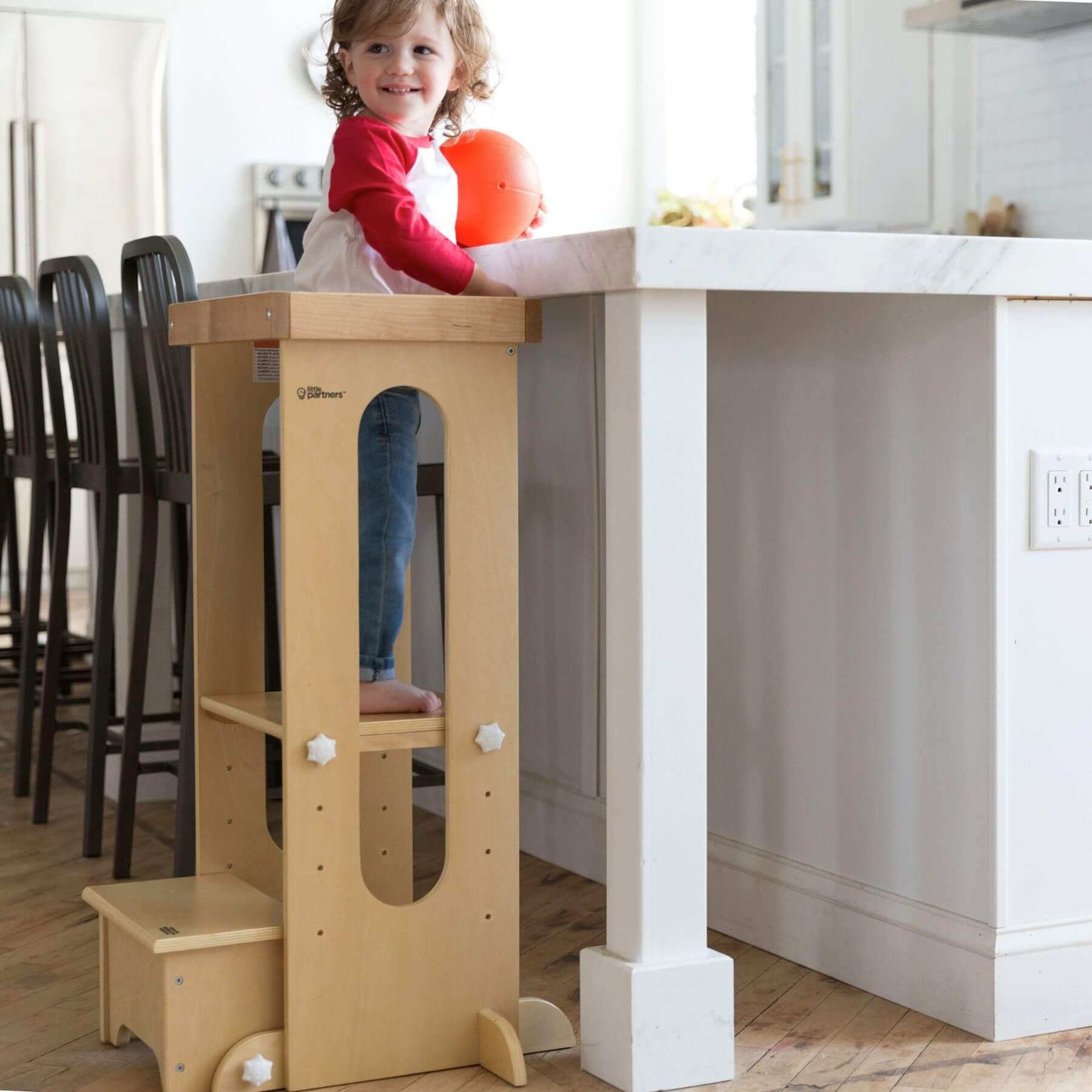 Girl Standing on Little Partners Explore 'N Store Learning Tower Natural