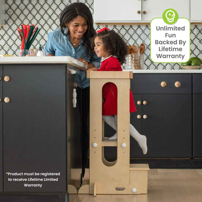 Girl Standing on Little Partners Explore 'N Store Learning Tower Natural next to Mom