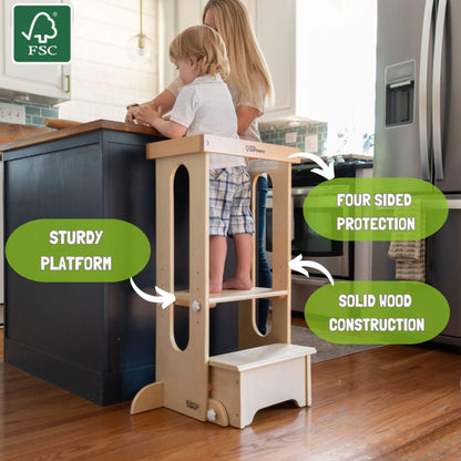 Boy Standing on Little Partners Explore 'N Store Learning Tower Natural next to Kitchen Counter