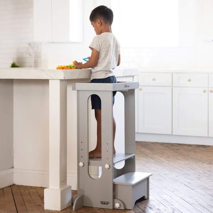 Boy Standing on Little Partners Explore 'N Store Learning Tower Silver