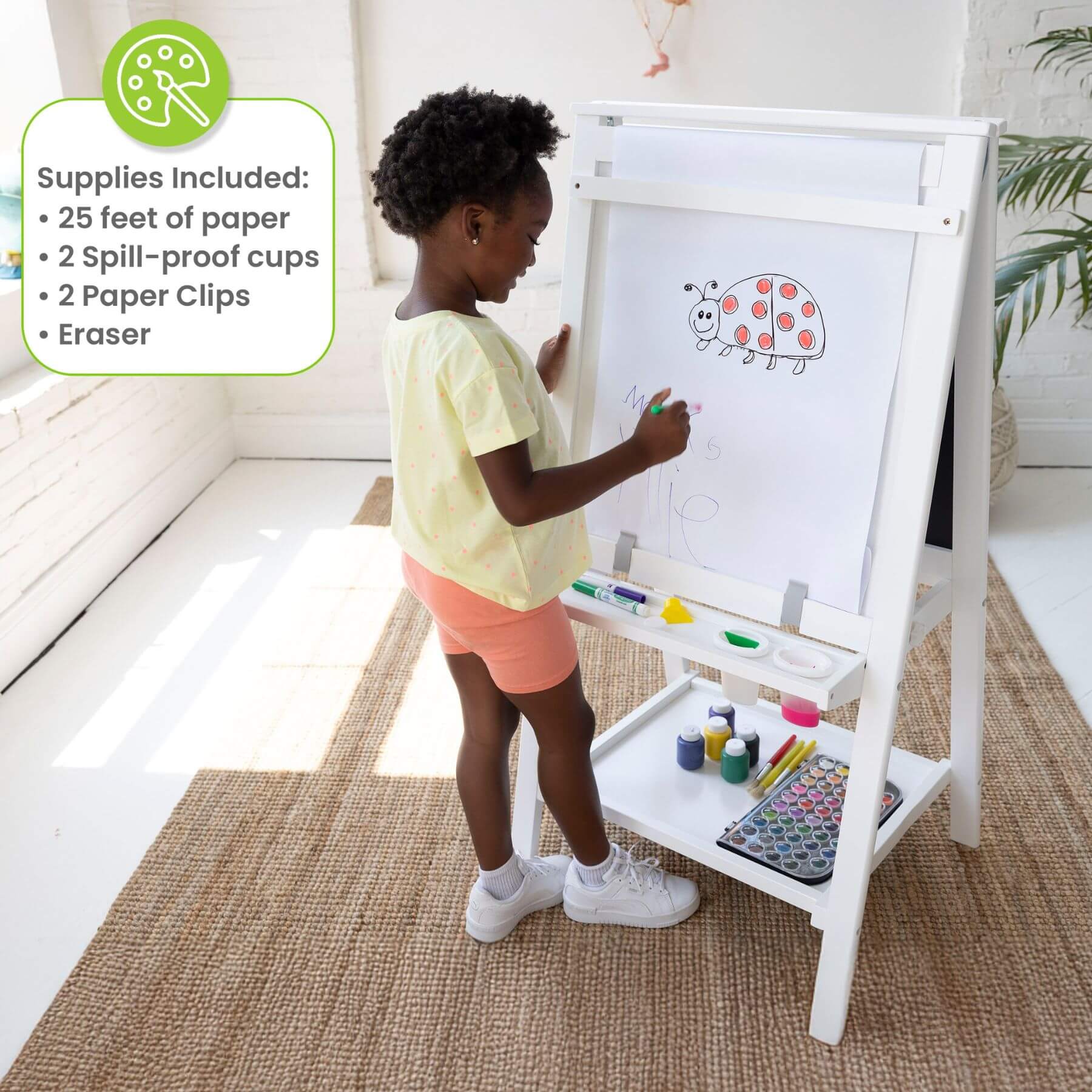 Child drawing on a Little Partners Folding Artist EZ Easel White with art supplies included