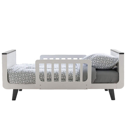 Little Partners MOD Toddler Bed Grey & White with gray mattress and patterned pillow on a white background