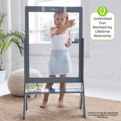 Girl Drawing on Little Partners Peek-A-Boo Easel Grey