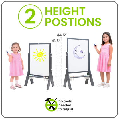Girl Standing next to Little Partners Peek-A-Boo Easel Grey