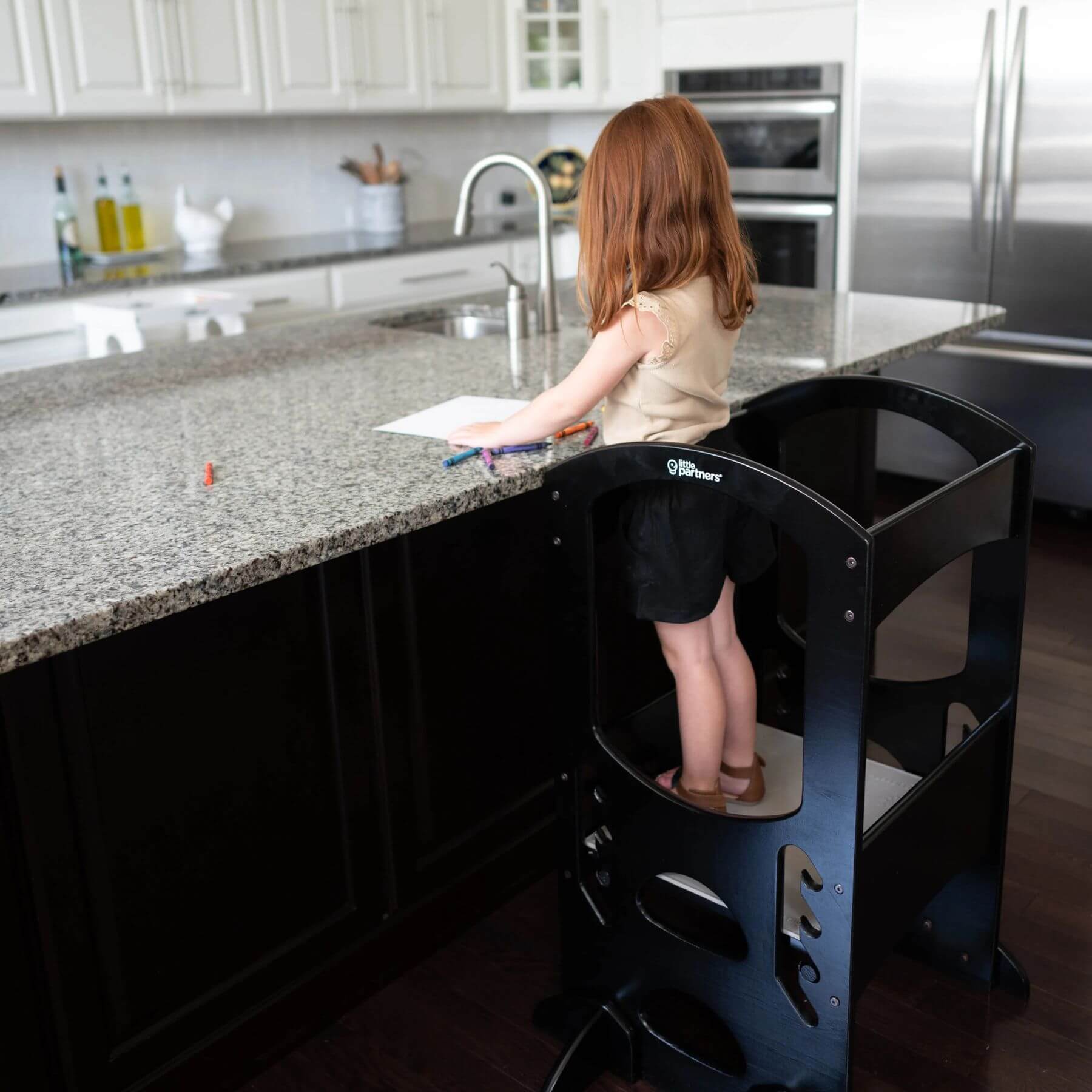 Girl Standing on Little Partners The Learning Tower Ebony, Drawing