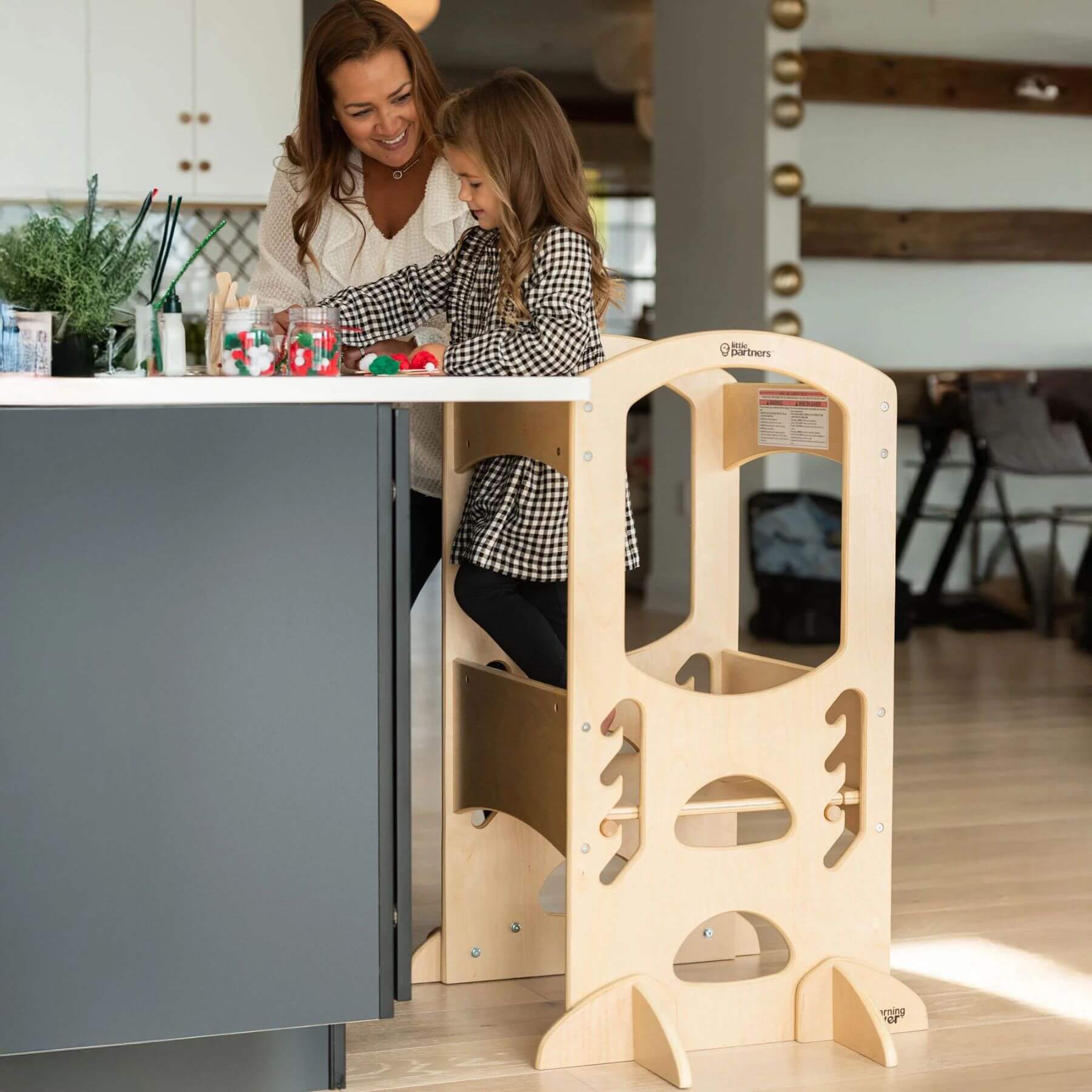 Girl Standing on Little Partners The Learning Tower Natural, Playing Games with Mom