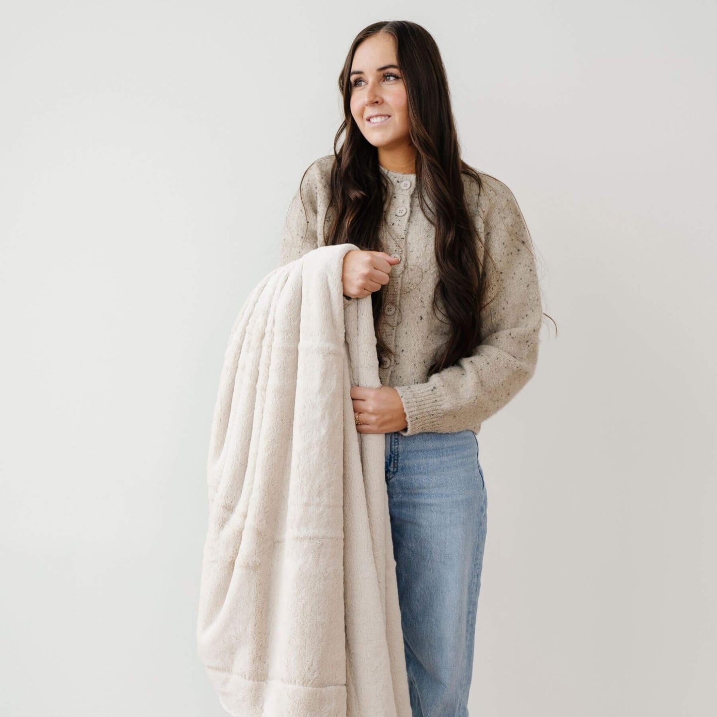 Woman holding a Saranoni Lush Throw Blankets