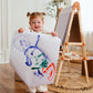 Girl Holding a Drawing next to Tiny Land® Magnitales Easel