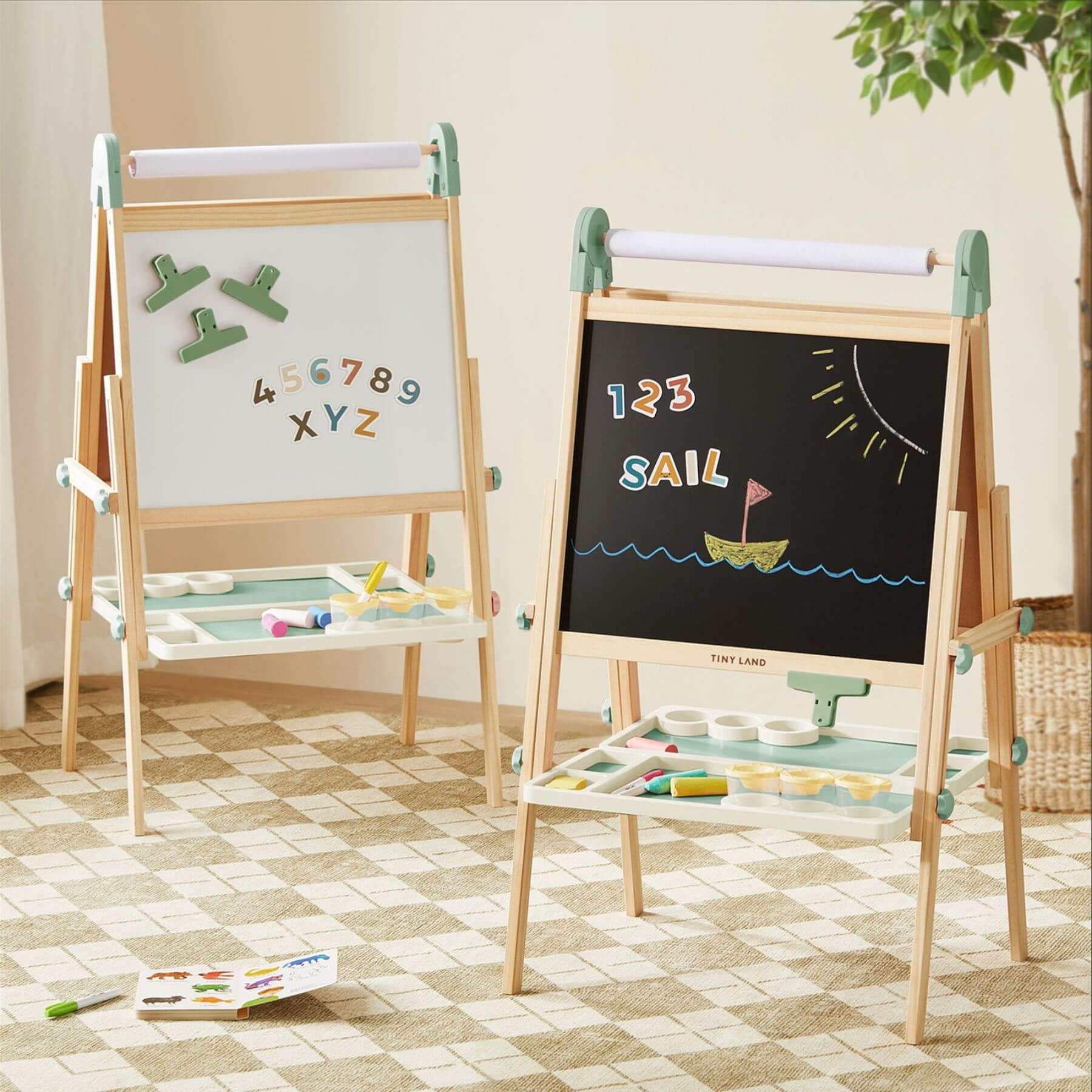 Two Tiny Land® Magnitales Easel for Kids - Green, displaying letters and numbers, in a room setting.