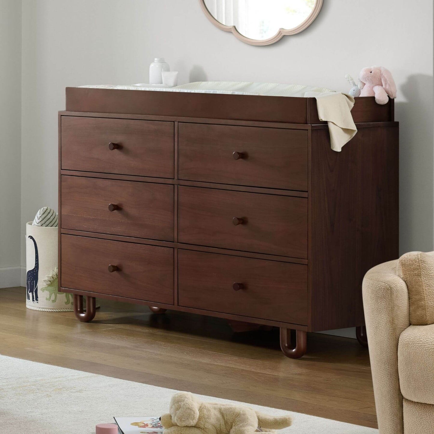 Soho Baby Meridian 6 Drawer Dresser - Cognac with changing table top in a nursery setting