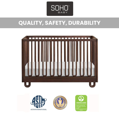 Soho Baby Meridian Island Crib - Cognac and a white mattress, shown on a white background with the SOHO BABY logo at the top and certification badges at the bottom.