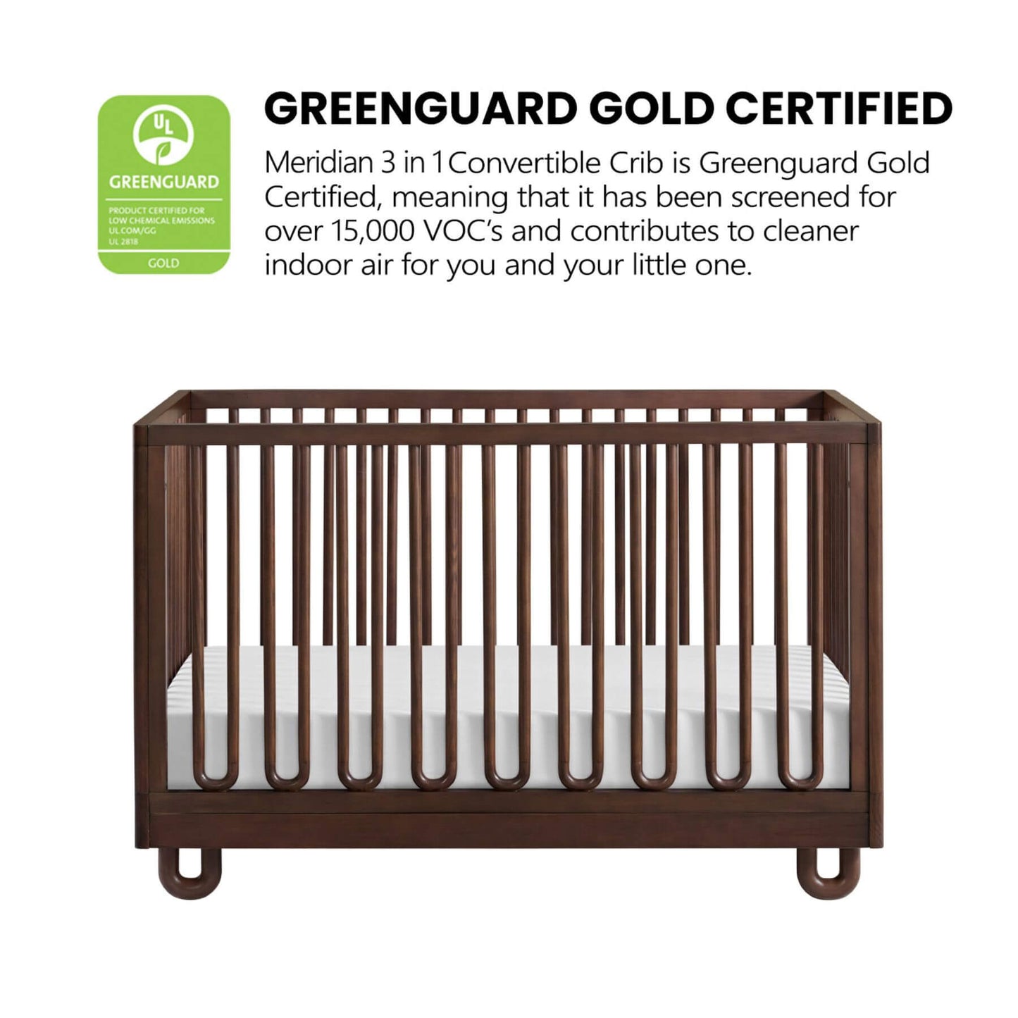 Soho Baby Meridian Island Crib - Cognac and a white mattress, shown on a white background with a green and black GreenGuard Gold Certified badge and text above it.