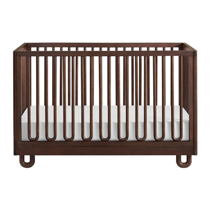 Soho Baby Meridian Island Crib - Cognac and a white mattress, shown from a front three-quarter angle on a solid white background.