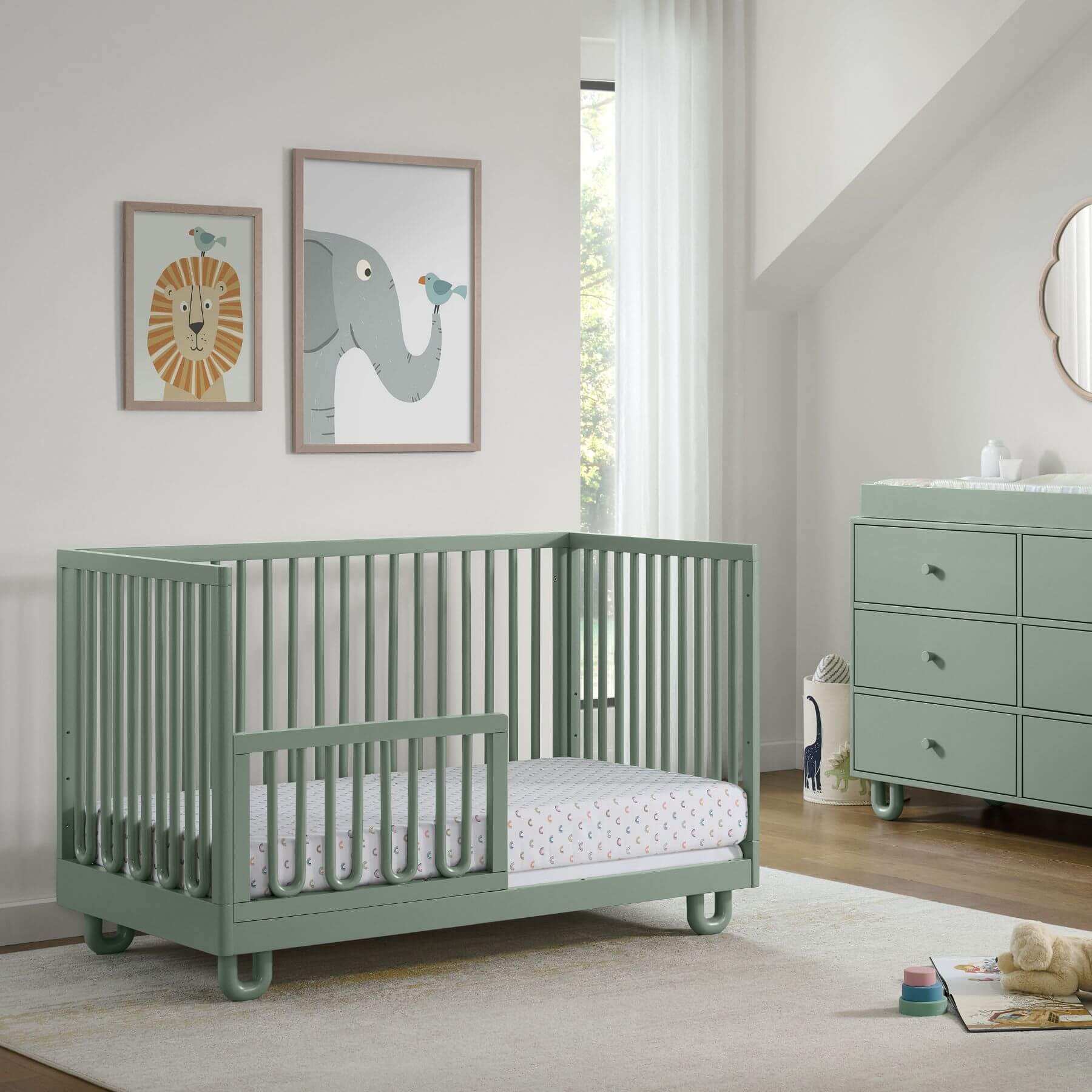 Soho Baby Meridian Island Crib - Olive Green with a matching dresser in a bright, modern nursery.