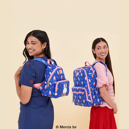 Two young women modeling Miffy Flower Fields Everyday Mini Backpack - Blue & Orange