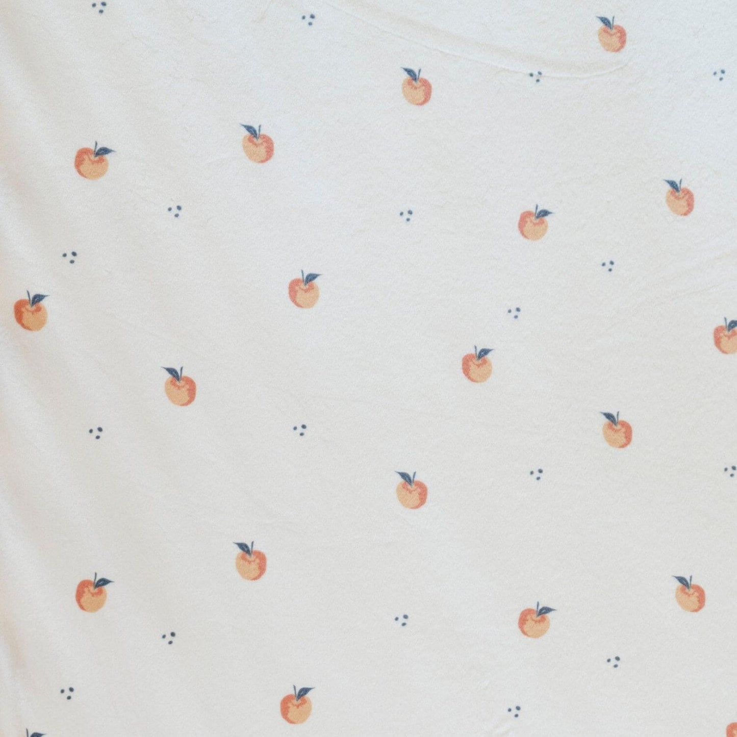 Close-up of Saranoni Minky Stretch Luxe Crib Sheet Apple