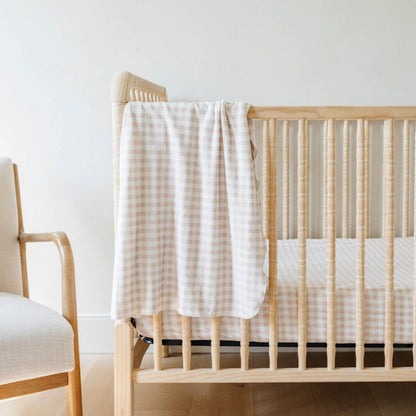 Saranoni Minky Stretch Luxe Crib Sheet Gingham hanging on wooden crib
