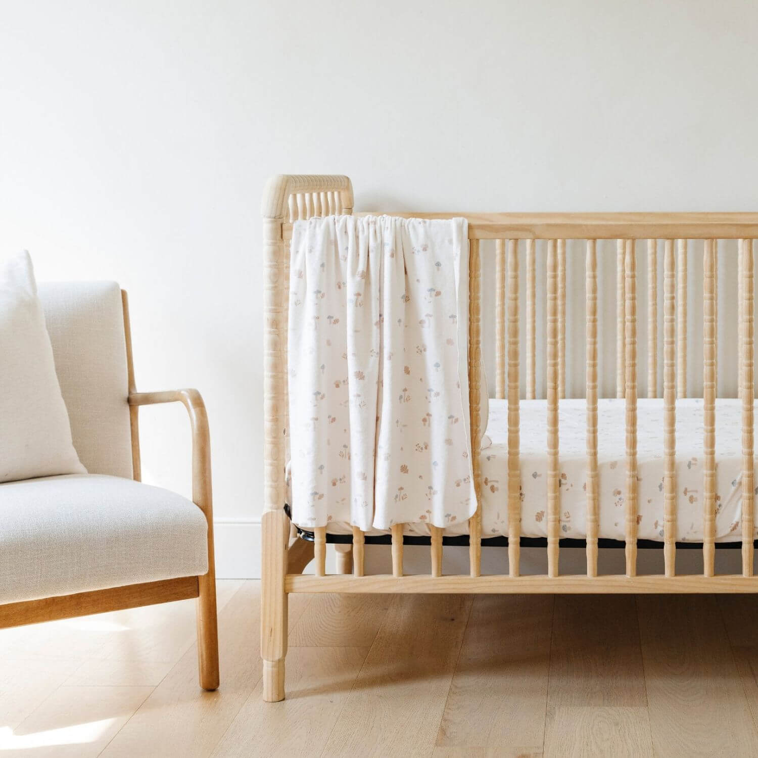 Saranoni Minky Stretch Luxe Crib Sheet Mushrooms hanging on wooden crib