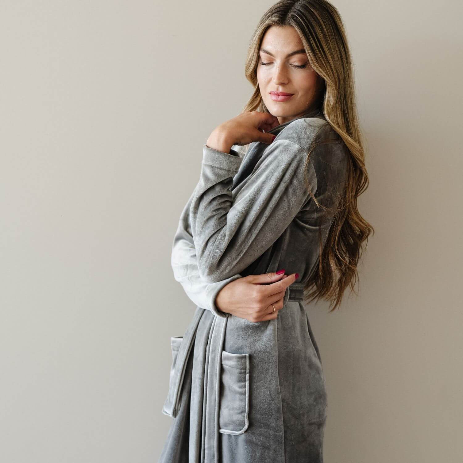 Woman wearing Saranoni Minky Stretch Luxe Robe - Charcoal against a plain background