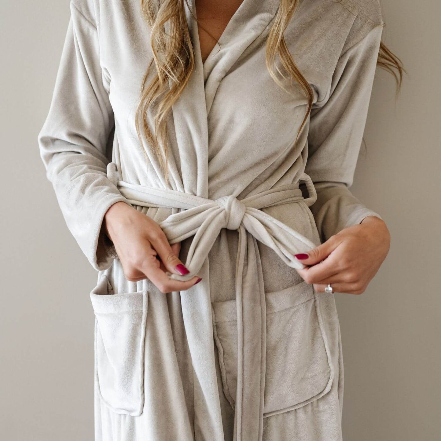 Person wearing Saranoni Minky Stretch Luxe Robe - Sandshell with a neutral background