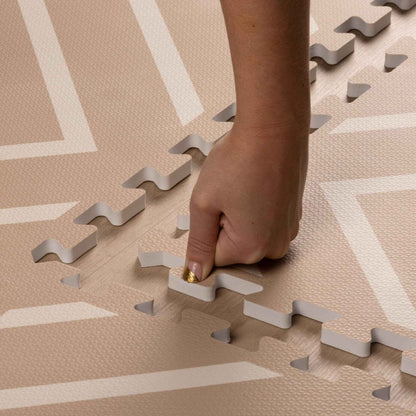 Hand placing Eeveve Modern Blocks Play Mat - Beige