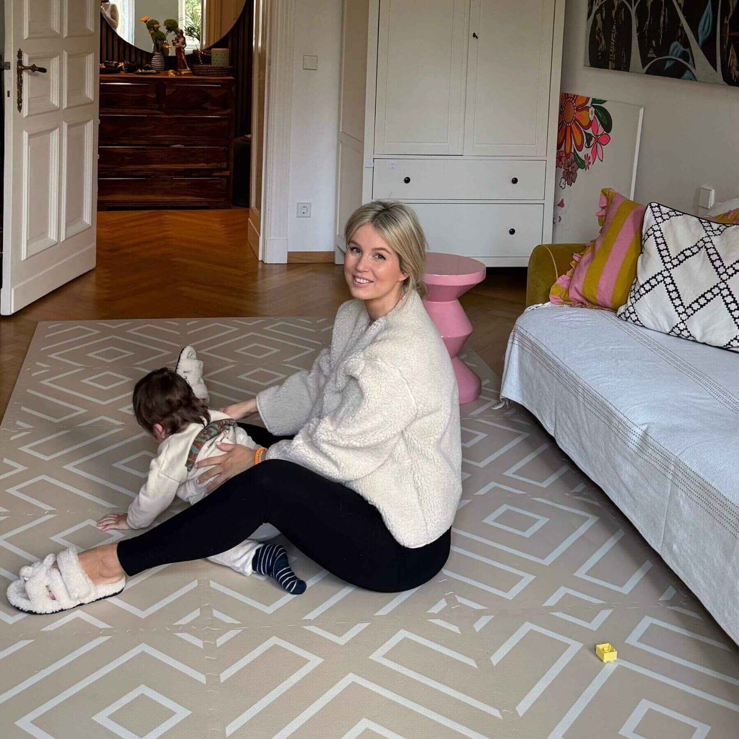 Woman and child playing on Eeveve Modern Blocks Play Mat - Beige in a living room.
