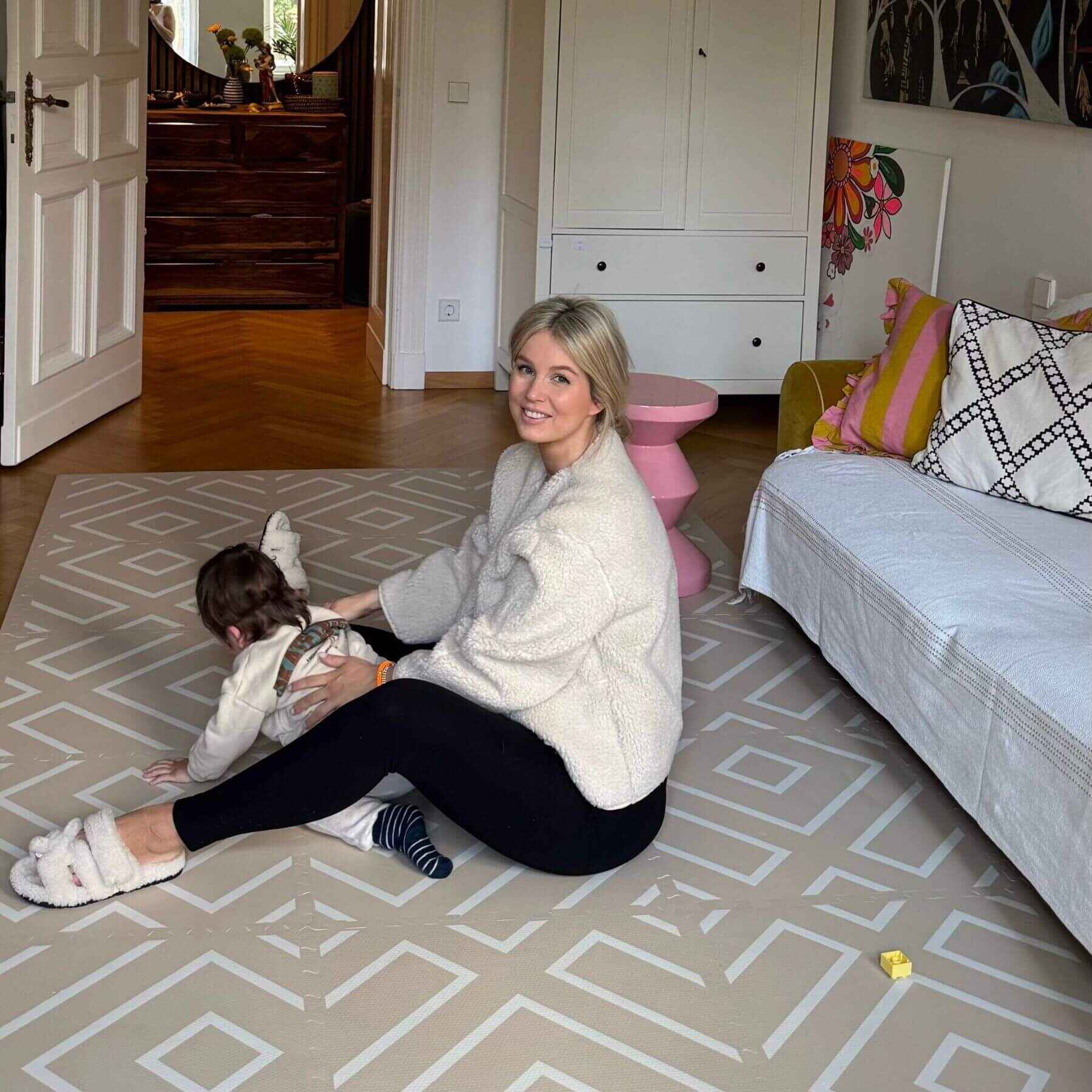 Woman and child playing on Eeveve Modern Blocks Play Mat - Beige in a living room.