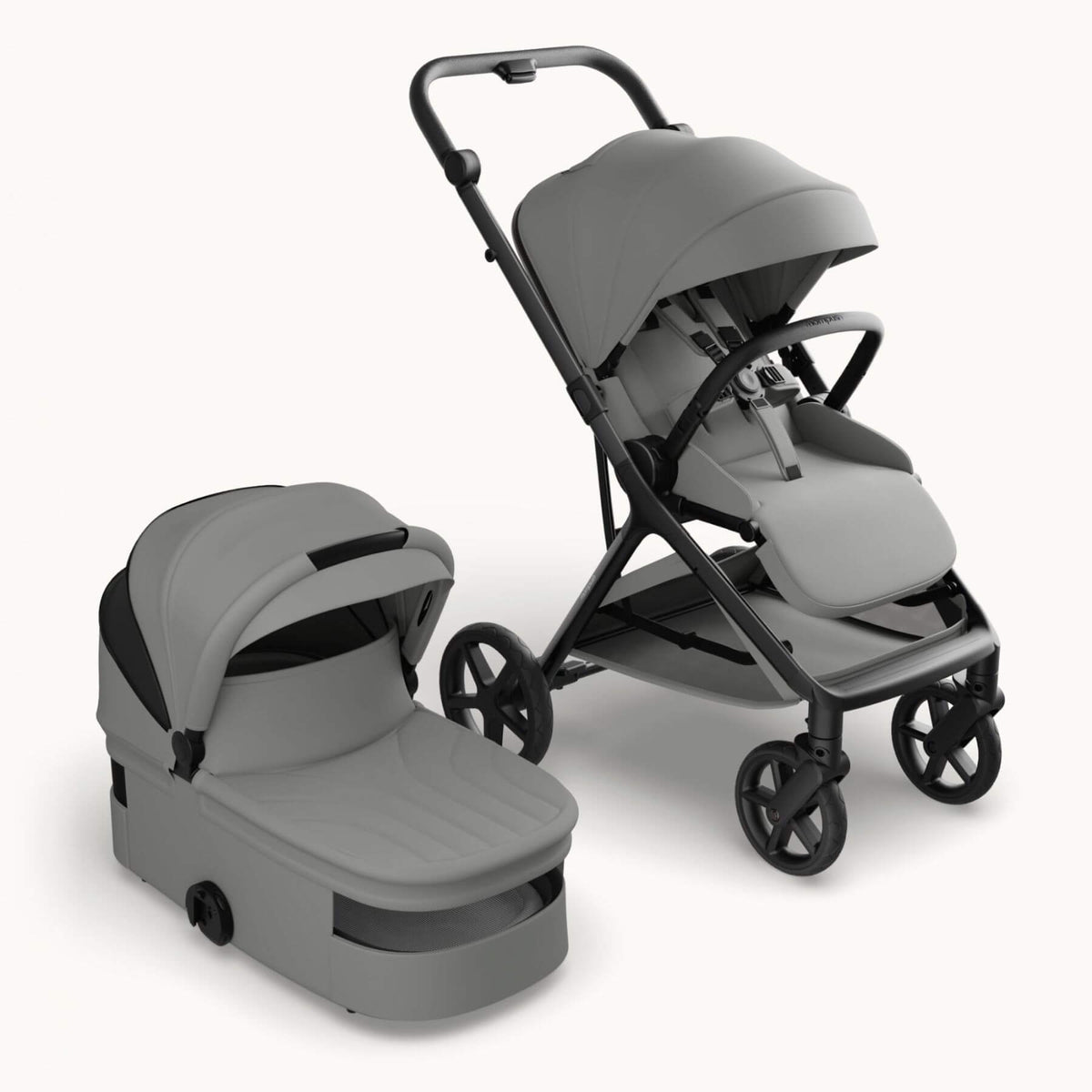 Mompush Vira stroller with bassinet - Gray, shown on a clean off-white background. The stroller features a canopy, seat with harness, and a matching bassinet is positioned next to it.