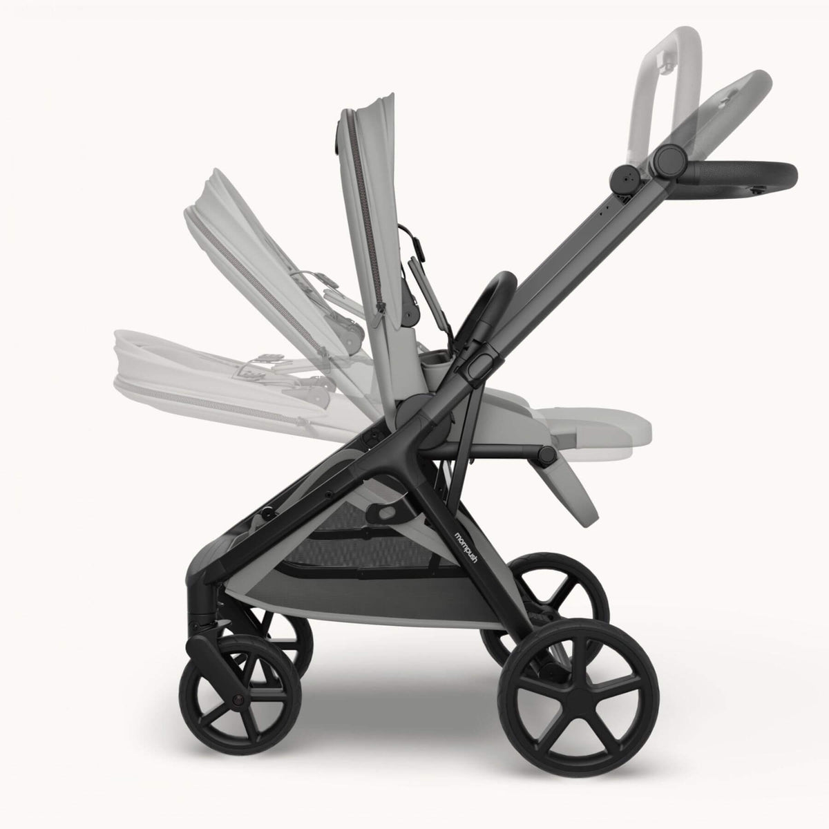 Mompush Vira stroller - Gray shown in side profile on a clean light gray studio background, with a faded secondary view of the seat/cushion configuration behind it to demonstrate flexibility.