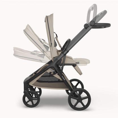 Mompush Vira stroller - Khaki, shown in a side profile with one seat reclined and the other upright, on a light off-white background.
