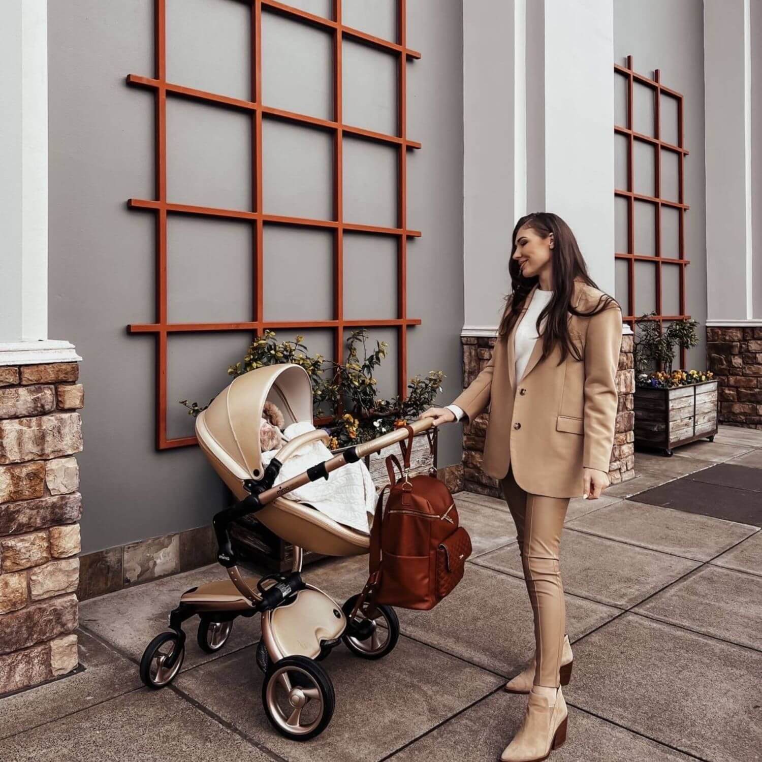 Mom Pushing a Baby on Stroller with Luli Bebé Monaco Diaper Bag | Caramel Brown