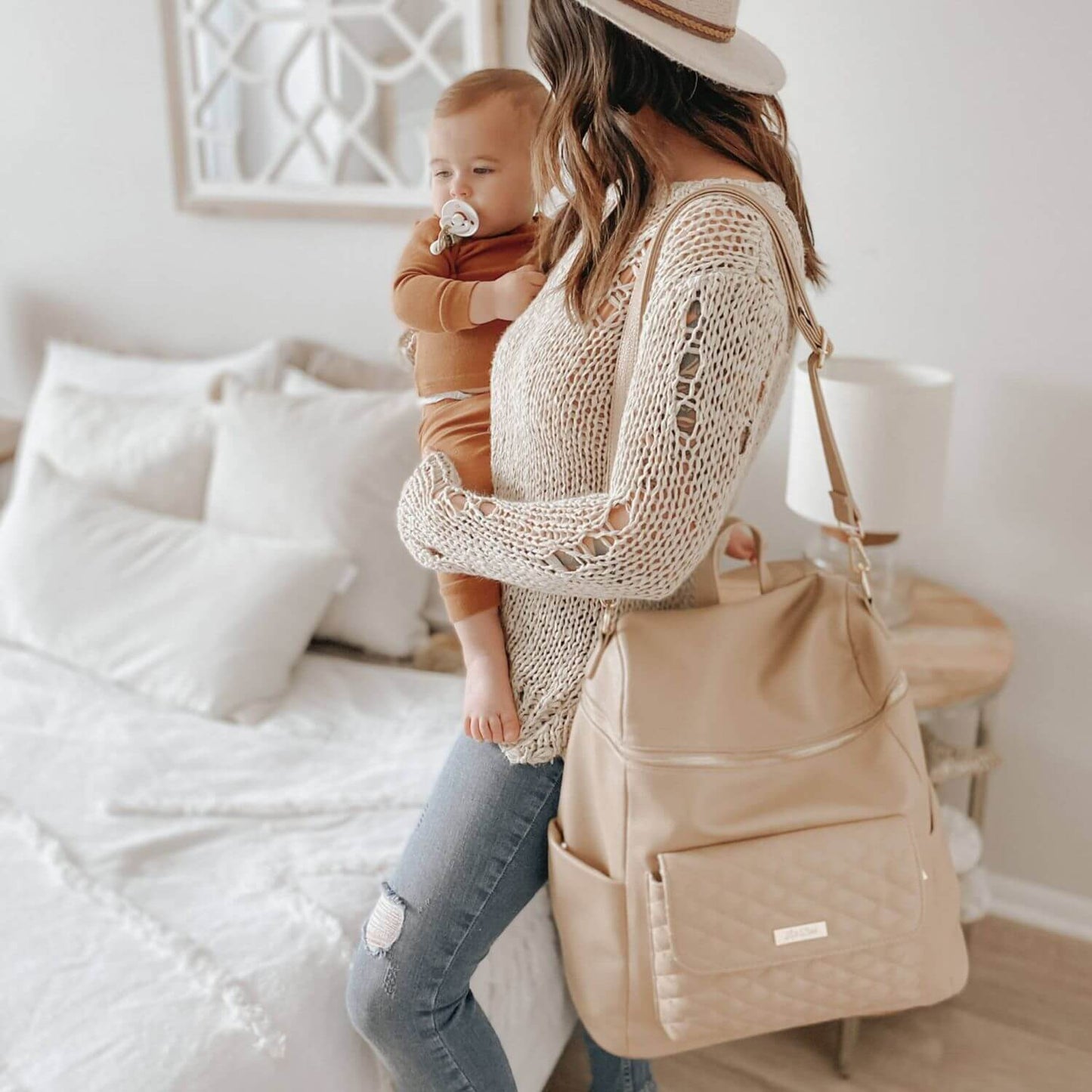 Mom Holding Baby, Carrying Luli Bebé Monaco Diaper Bag | Latte Brown