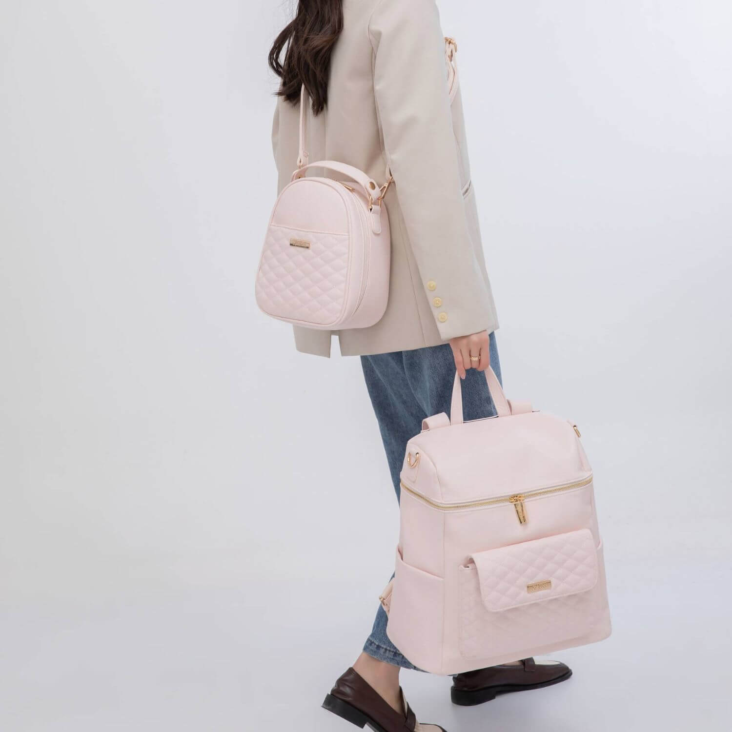 Woman Holding Luli Bebé Monaco Diaper Bag | Pastel Pink