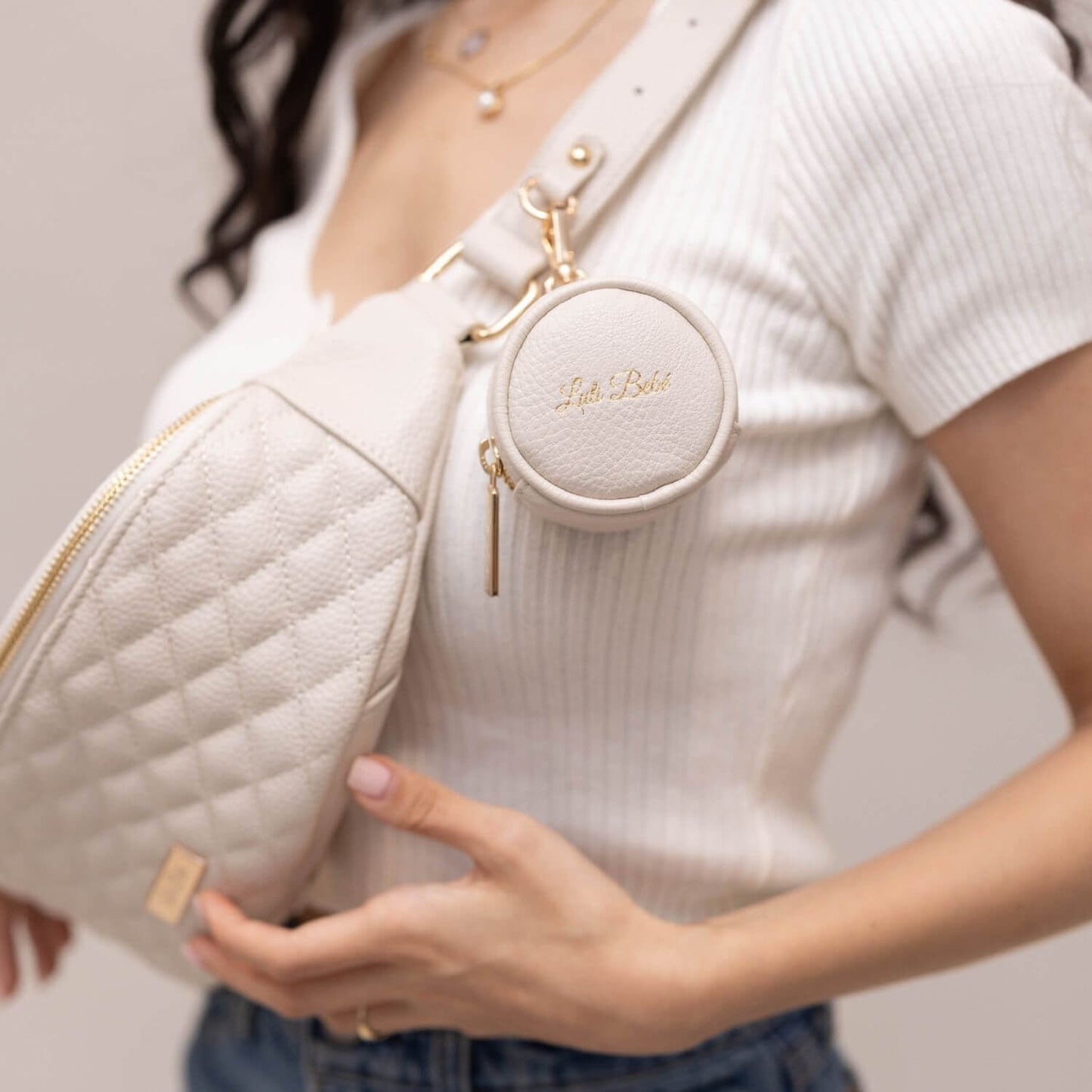 Woman Carrying Luli Bebé Monaco Sling Bag | Pearl White