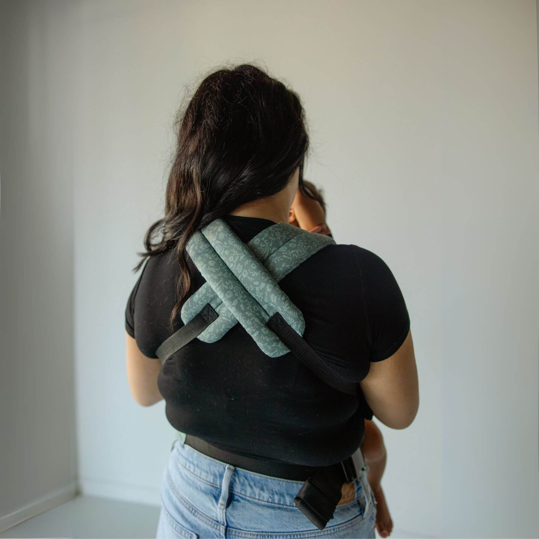 Person wearing Monroe x Coco Bloom – Neutral Cotton Baby Carrier