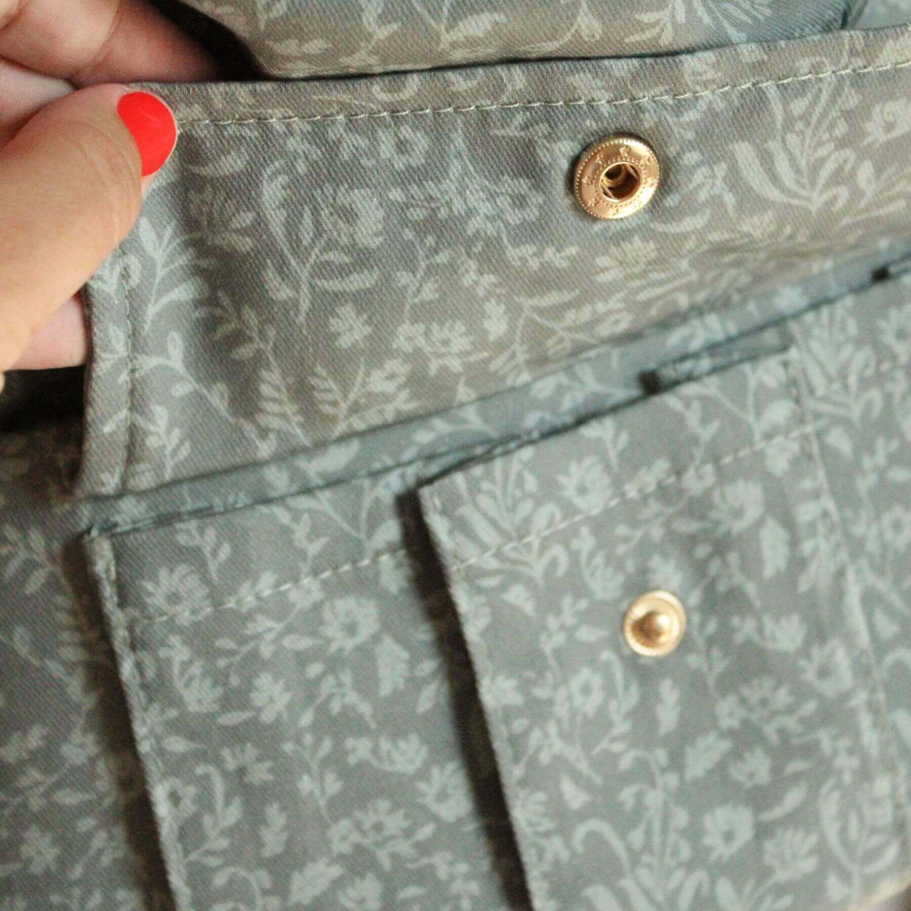 Close-up of Monroe x Coco Bloom – Neutral Cotton Baby Carrier